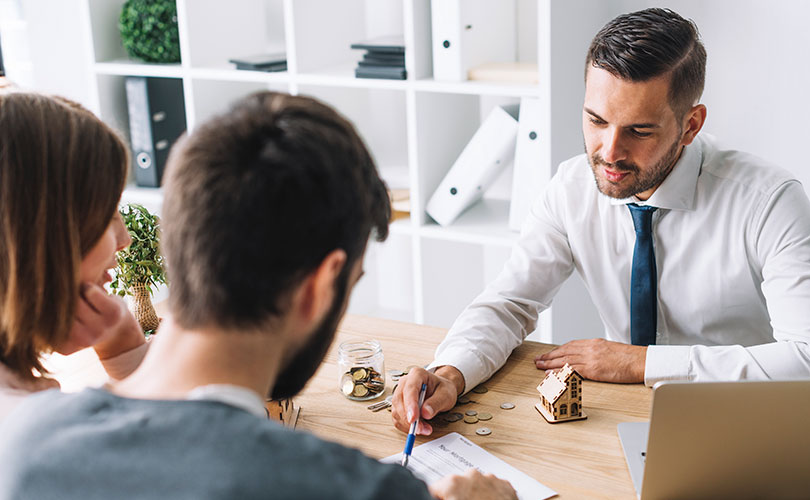 Advisor reviewing merchant cash advance agreements with business owners